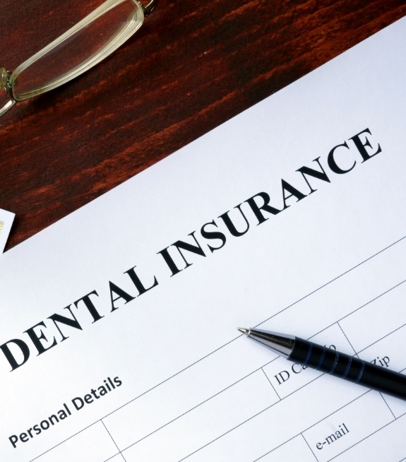 Dental insurance paperwork on desk