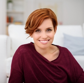 Smiling woman in red sweater