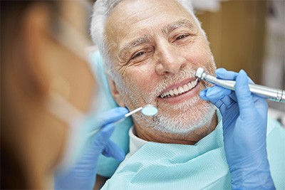 Patient smiling while visiting dentist