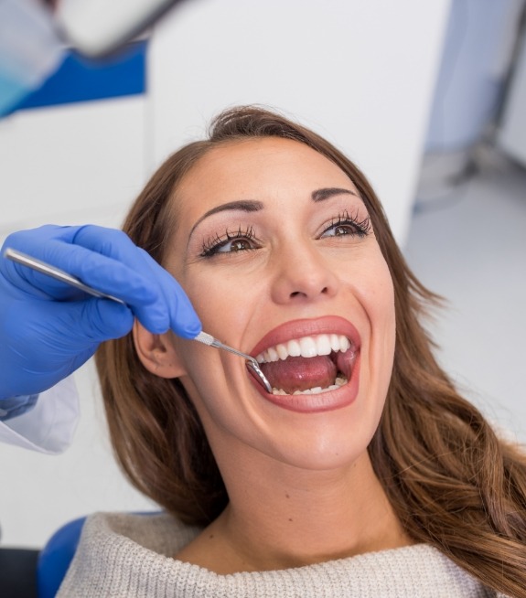 Woman receiving a dental checkup