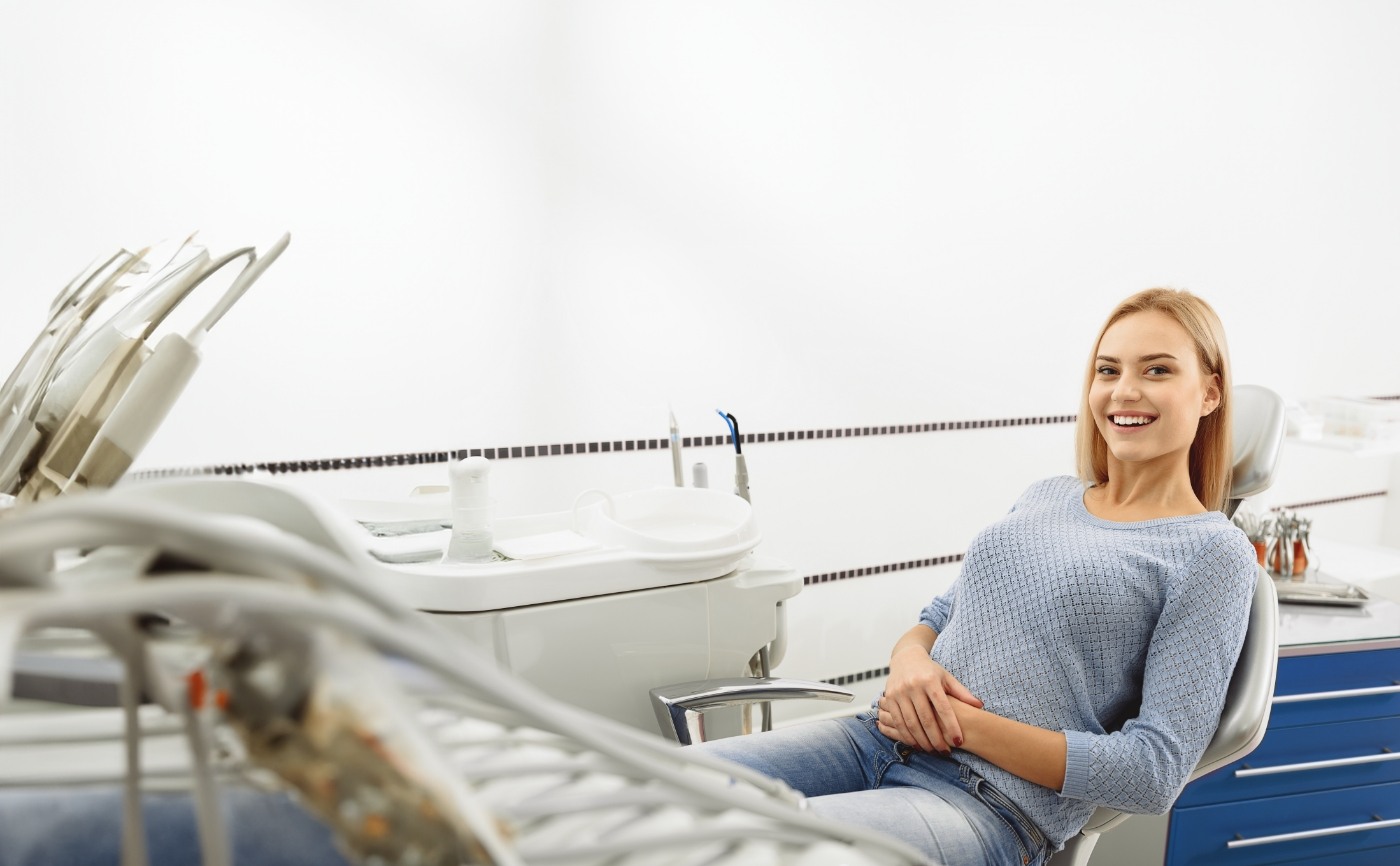 Woman smiling in dental chair during preventive dentistry checkup in Julington Creek